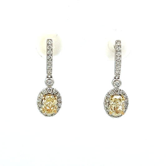 1.08ct total weight oval yellow diamonds and 0.33ct total weight round diamond dangle earrings