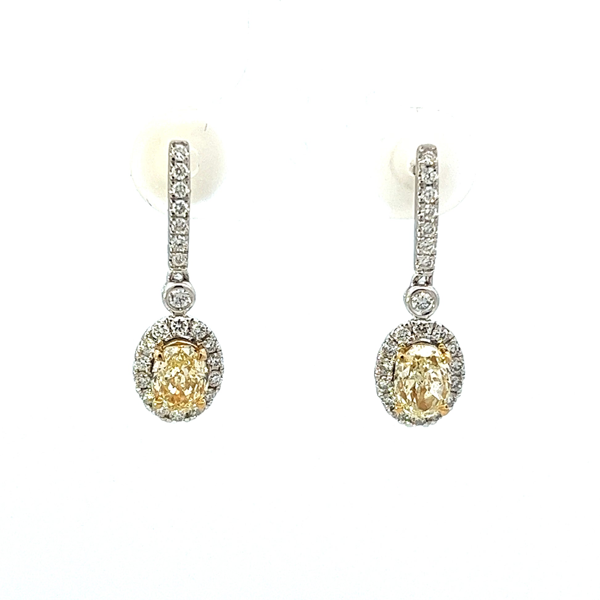 1.08ct total weight oval yellow diamonds and 0.33ct total weight round diamond dangle earrings