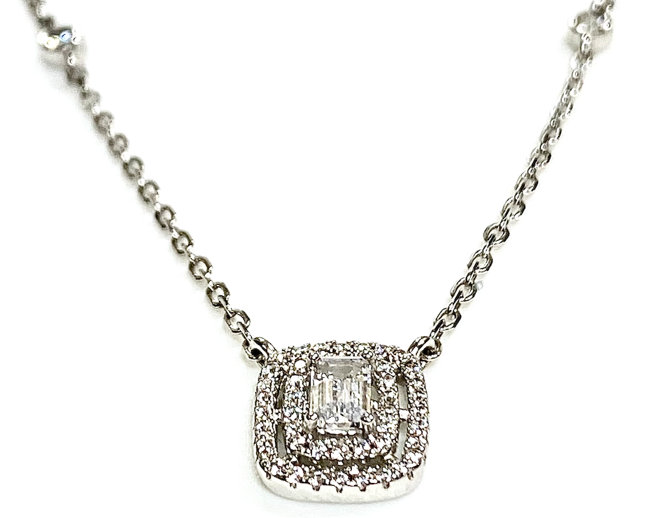 Lab grown emerald cut stone with halo pendant and sterling silver chain